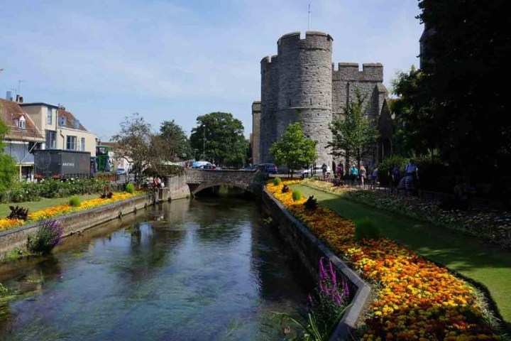 a castle surrounded by a body of water